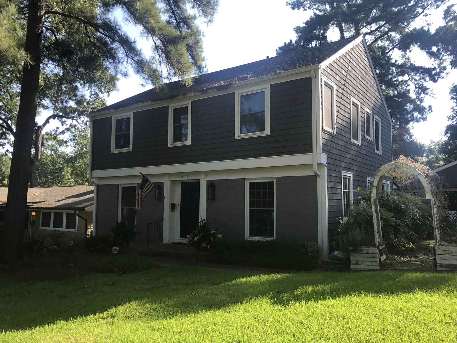 New windows and exterior work — at a home with grass and trees