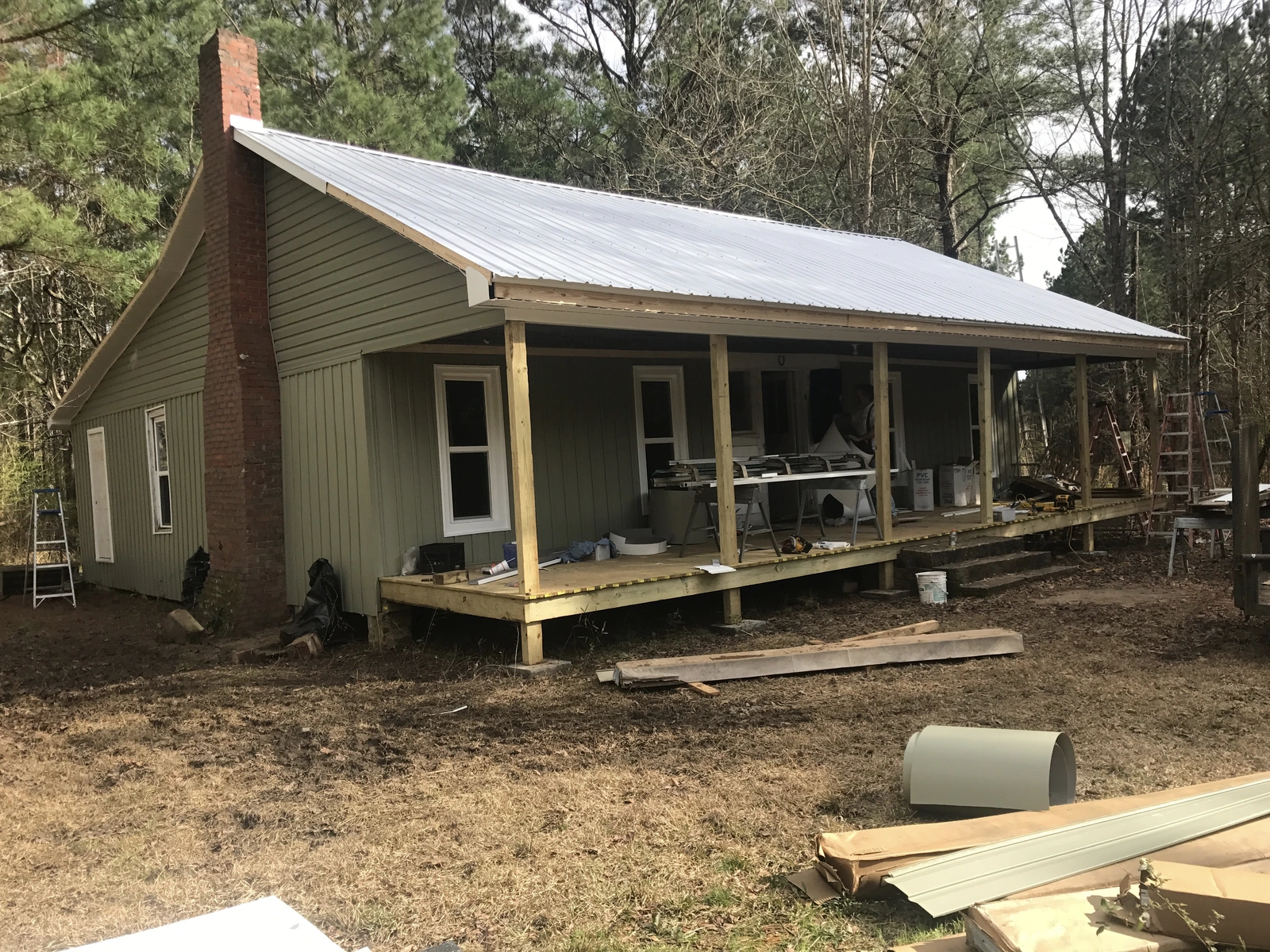 New windows and exterior work — at house with porch and siding
