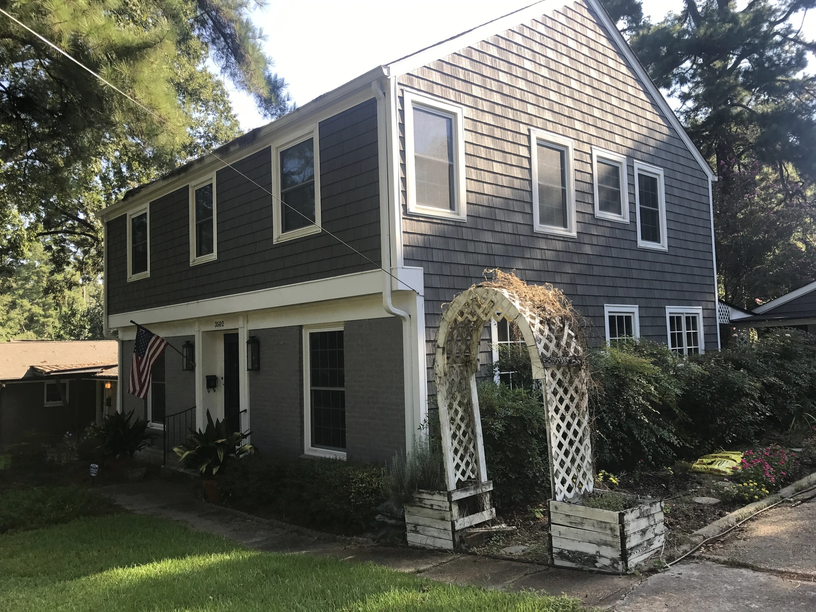 New windows and exterior work — modern house with garden and swing